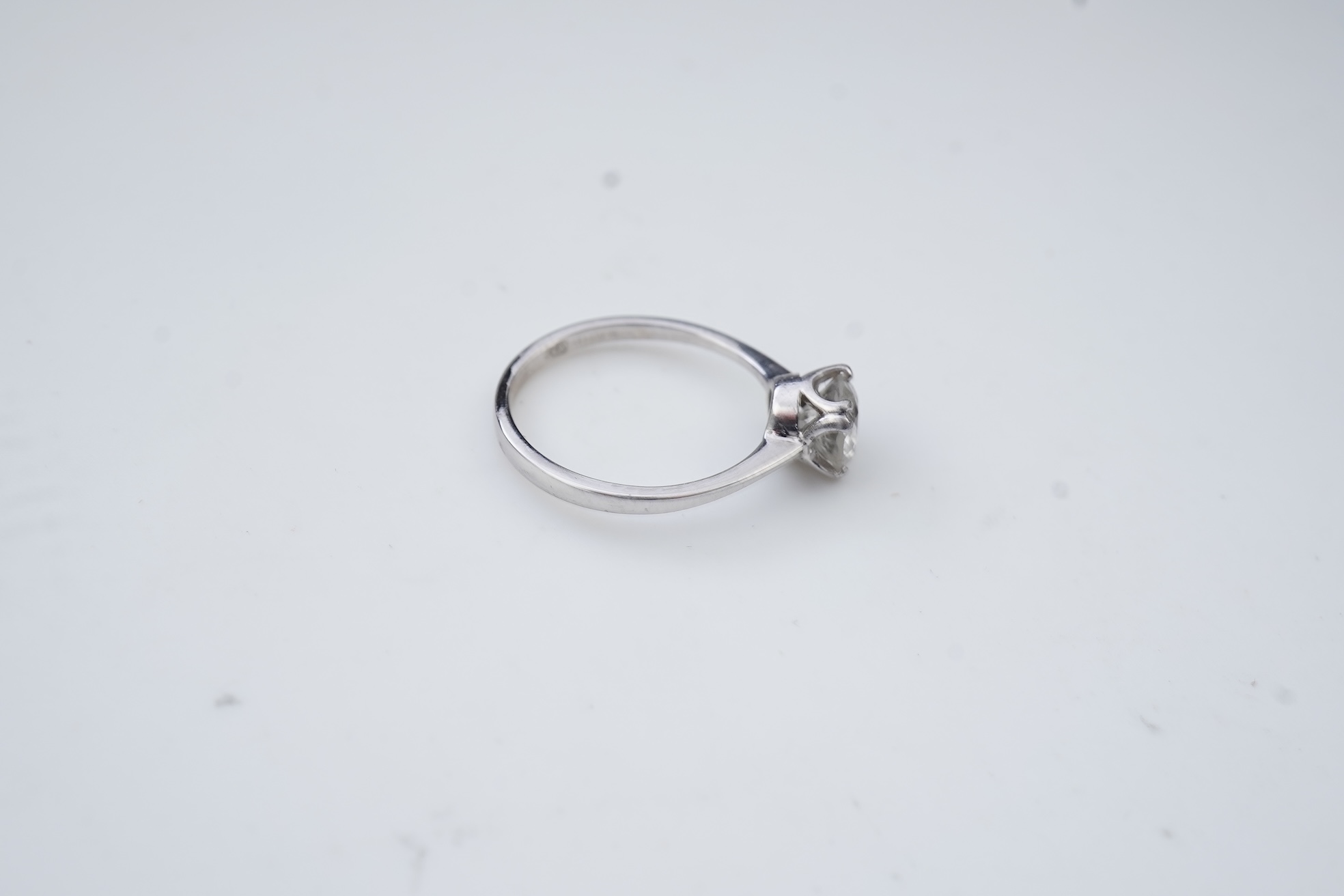 A diamond solitaire ring